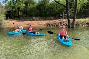 Three women Kayaking individually