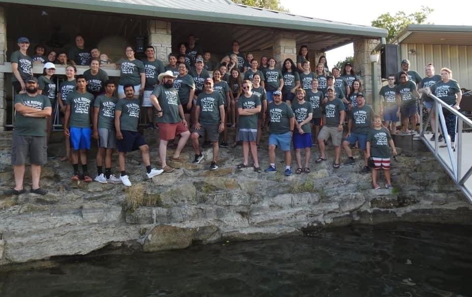 A group of people standing on top of rocks.