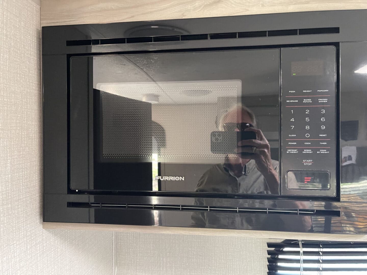 A Furrion microwave oven mounted on the wall