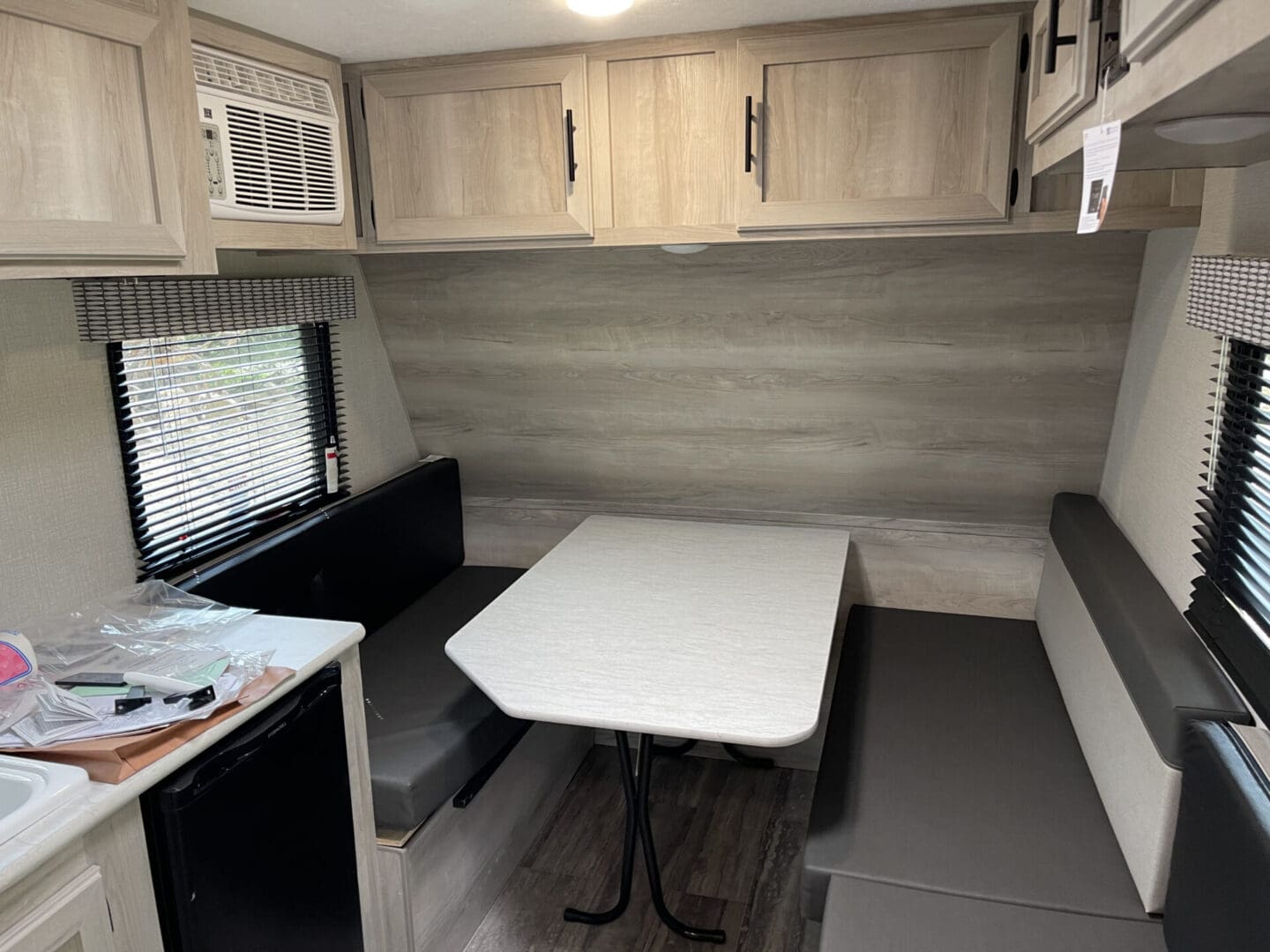 A table and chairs in the back of an rv.