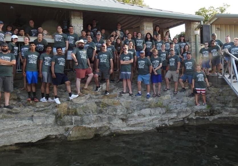 A group of people standing on top of rocks.